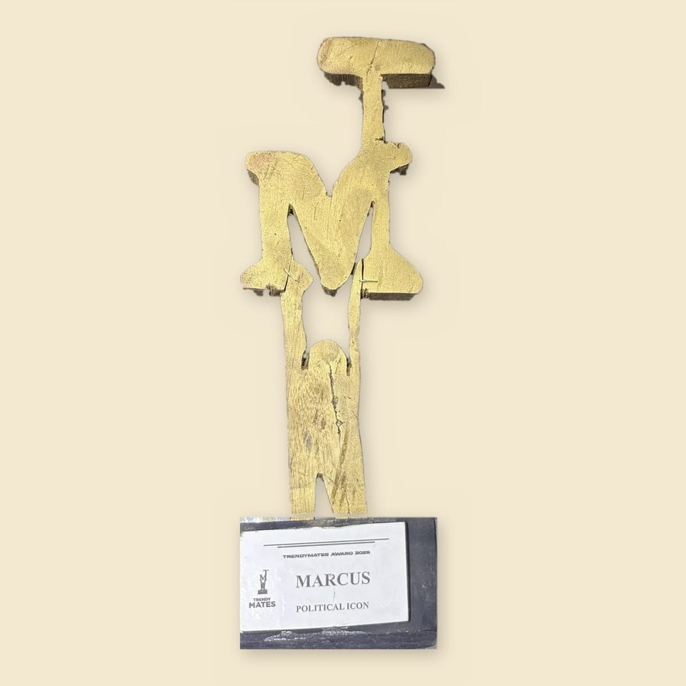 Gold TrendyMates trophy with a plaque reading Marcus, Political Icon
